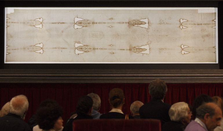 People view the Shroud of Turin on display at the Cathedral of St. John the Baptist in Turin, Italy, on April 26, 2010. (CNS/Paul Haring)