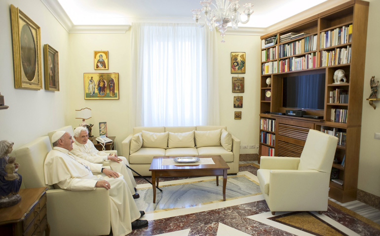 Pope Francis and retired Pope Benedict XVI talk Tuesday at the Vatican. (CNS/Reuters/L'Osservatore Romano)