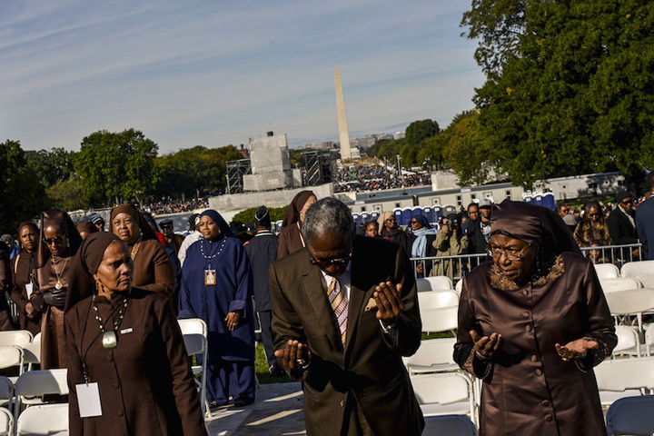 Attendees are led in prayer at a rally convened by Nation of Islam leader Louis Farrakhan and billed as “Justice or Else” to mark the 20th anniversary of the Million Man March on the National Mall in Washington, Oct. 10, 2015. The original Million Man March took place on Oct. 16, 1995. (Reuters/James Lawler Duggan)