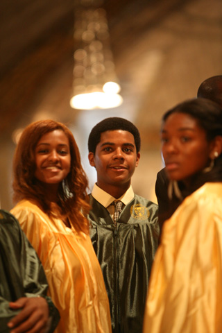 From left, Tsion Abera, Michael Chase and Melissa Savage attend Archbishop Carroll High School's 2013 Baccalaureate Mass on May 22 in Washington, D.C. 