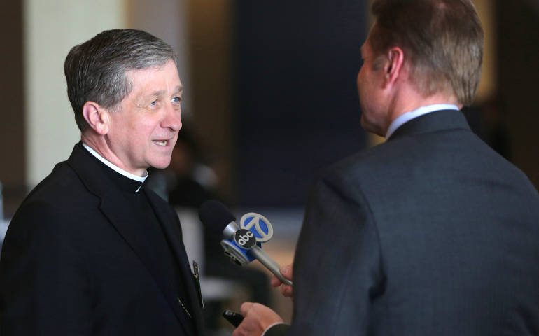 Bishop Blase Cupich talks with a reporter June 11 at  the meeting of the U.S. bishops in New Orleans. (CNS/Bob Roller)