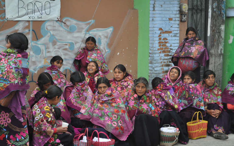 Early Monday morning, indigenous families from Chamula wait for the pope's arrival in San Cristobal de Las Casas, Chiapas, Mexico. (J. Malcolm Garcia.) 