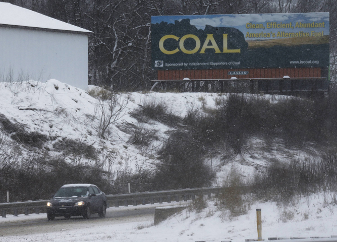 A billboard carries a message supporting the coal industry near Wheeling, W.Va., in January 2013. (Newscom/Reuters/Jason Cohn)