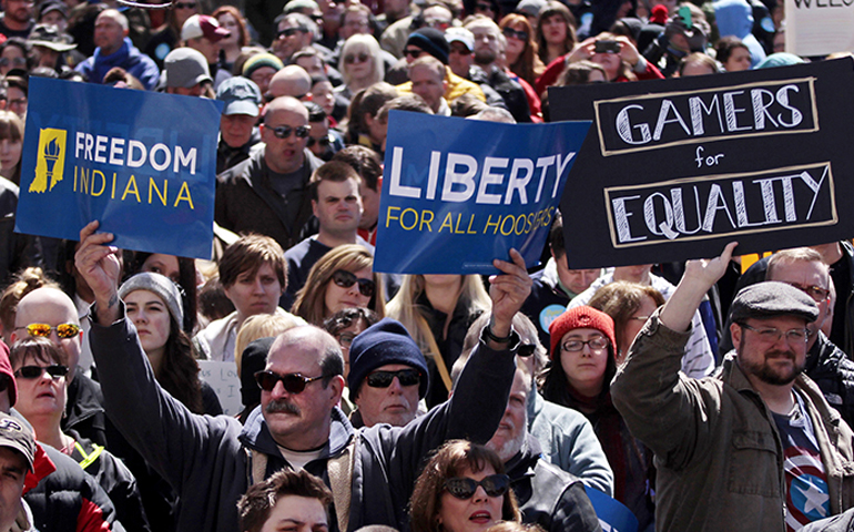 Demonstrators gather at Indianapolis' Monument Circle on March 28, 2015, to protest a religious freedom bill signed by Indiana Gov. Mike Pence. More than 2,000 people gathered at the Indiana capital to protest the bill, saying it would promote discrimination against individuals based on sexual orientation. (Reuters/Nate Chute)