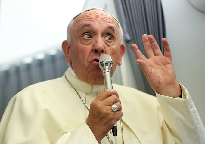 Pope Francis speaks to journalists onboard the papal plane during his return to Rome, from Asuncion, Paraguay, on July 12, 2015. (Alessandro Bianchi, Reuters)