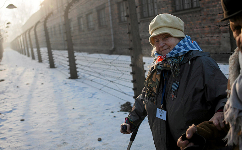 Survivors walk in the former Nazi German concentration and extermination camp Auschwitz-Birkenau in Oswiecim, Poland, on Jan. 27, 2017, to mark the 72nd anniversary of the liberation of the camp by Soviet troops and to remember the victims of the Holocaust. (Photo courtesy of Reuters/Agency Gazeta/Kuba Ociepa)