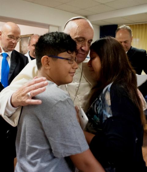 Pope Francis visits patients at the Villa Speranza hospice, which is connected to Gemelli Hospital, in Rome Sept. 16, 2016. The visit was part of the pope's series of Friday works of mercy during the Holy Year. (CNS/L'Osservatore Romano, handout)
