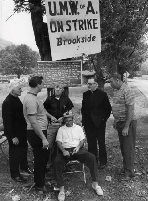 Msgr. George Higgins, second from right, supports striking mine workers in Kentucky's Harlan County in this 1974 file photo. Higgins, longtime chaplain to the AFL-CIO, died May 1, 2002. (CNS/file photo)