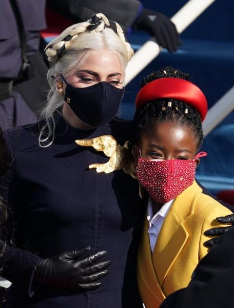 Amanda Gorman, right, poses for a photo with Lady Gaga at the U.S. Capitol Jan. 20, 2021, during the inauguration of Joe Biden as the 46th president of the United States. (CNS/Reuters/Kevin Lamarque)