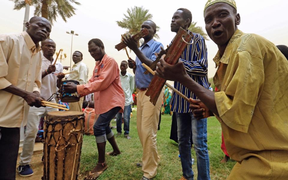 South Sudanese sing traditional songs June 25 in Khartoum during a South Sudan peace meeting as part of talks to negotiate an end to a civil war that broke out in 2013. (CNS/Reuters/Mohamed Nureldin Abdallah)