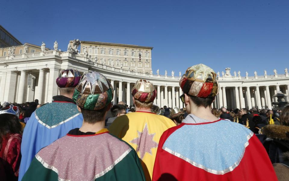 Children dressed as the Magi attend the Angelus led by Pope Francis from the window of his studio overlooking St. Peter's Square at the Vatican Jan. 1. (CNS/Paul Haring) 