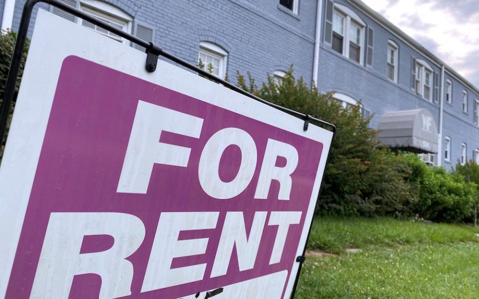 A "For Rent" sign is displayed in front of an apartment building June 20 in Arlington, Virginia. (CNS/Reuters/Will Dunham)