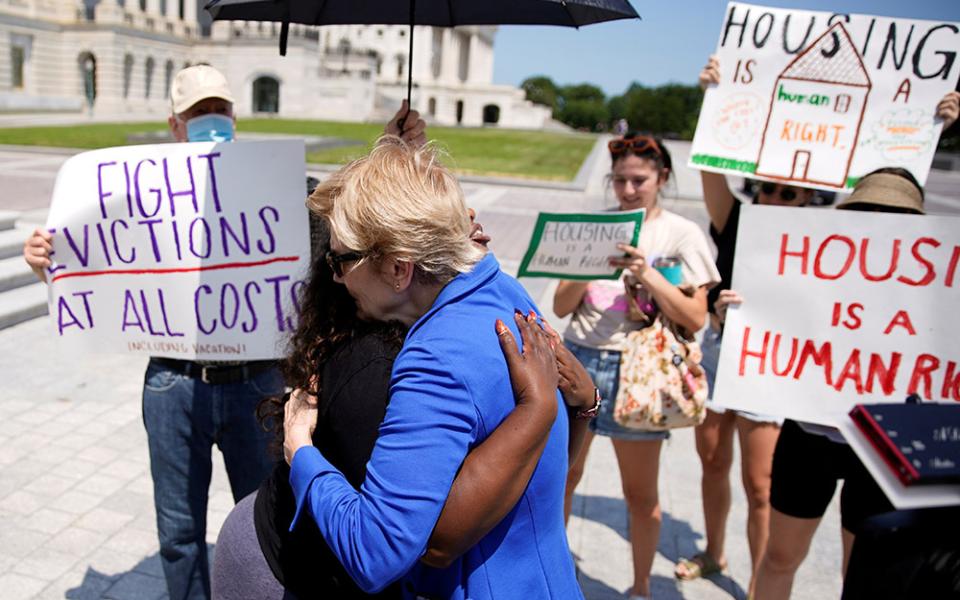 U.S. Rep. Cori Bush and U.S. Sen. Elizabeth Warren embrace July 31, 2021, in front of the U.S. Capitol in Washington. Bush spent the night there to highlight the midnight expiration of a pandemic-related federal moratorium on residential evictions. (CNS)