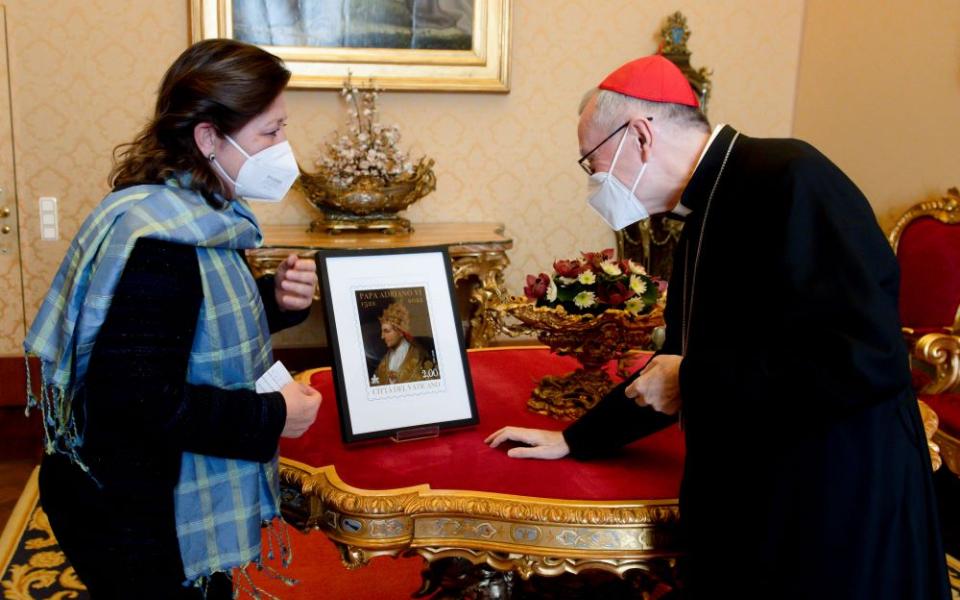 Caroline Weijers, ambassador of the Netherlands to the Holy See, presents a Vatican postage stamp showing Pope Adrian VI to Cardinal Pietro Parolin, Vatican secretary of state, at the Vatican March 4. (CNS/Vatican Media)