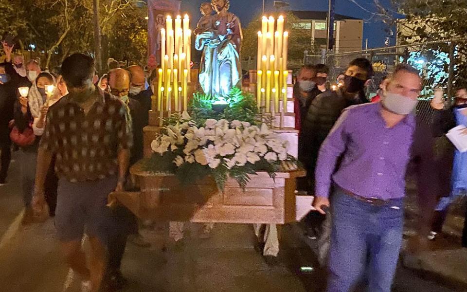 Several men carry a large statue of St. Joseph during the 2021 St. Joseph's Day procession hosted by St. Joseph Catholic Church in Houston. (Courtesy of Virginia Fraguio)