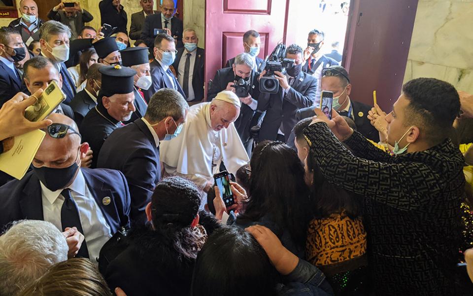 Pope Francis blesses a child amid a crowd of local Syriacs March 7 at the Church of the Immaculate Conception in Qaraqosh, the largest Catholic Church in Iraq. (Xavier Bisits)