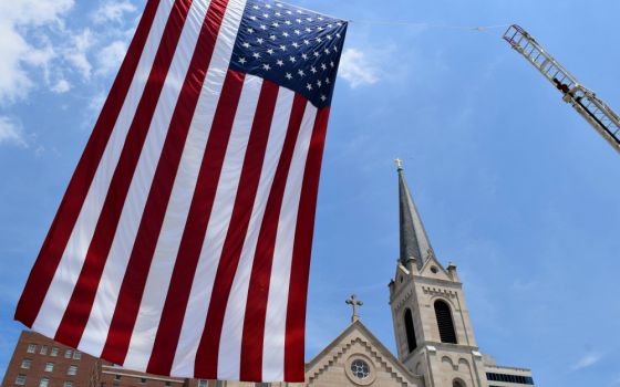 A 48-foot U.S. flag is seen June 24, 2016, outside Sacred Heart Church in downtown Peoria, Illinois. (CNS/Catholic Post/Tom Dermody)