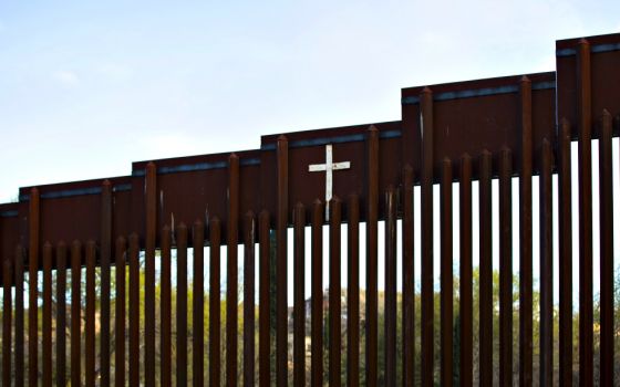 The bollard steel border fence splits the U.S. from Mexico in this view west of central Nogales, Arizona, Feb. 19. (CNS/Nancy Wiechec)