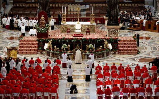 Pope Francis prays as he arrives for a consistory to create new cardinals in St. Peter's Basilica at the Vatican in June 2017. (CNS/Paul Haring)