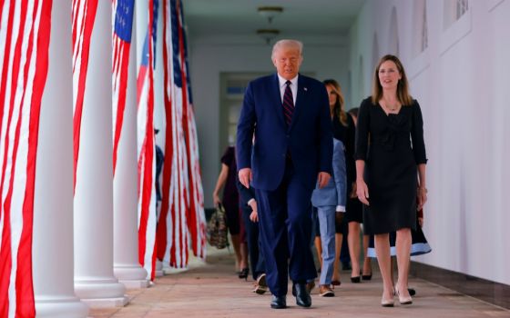 President Donald Trump arrives at the White House Rose Garden with federal Judge Amy Coney Barrett Sept. 26 to nominate her to fill the U.S. Supreme Court vacancy. (CNS/Reuters/Carlos Barria)