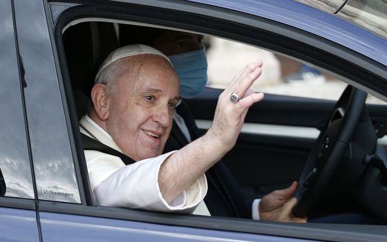 Pope Francis waves from his car after celebrating Mass and signing his new encyclical, "Fratelli Tutti, on Fraternity and Social Friendship" at the Basilica of St. Francis Oct. 3 in Assisi, Italy. (CNS/Paul Haring)