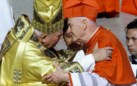 New U.S. Cardinal Theodore McCarrick kisses Pope John Paul II after he received the red biretta during a consistory ceremony in St. Peter's Square at the Vatican Feb. 21, 2001. (CNS/Vincenzo Pinto, Reuters)