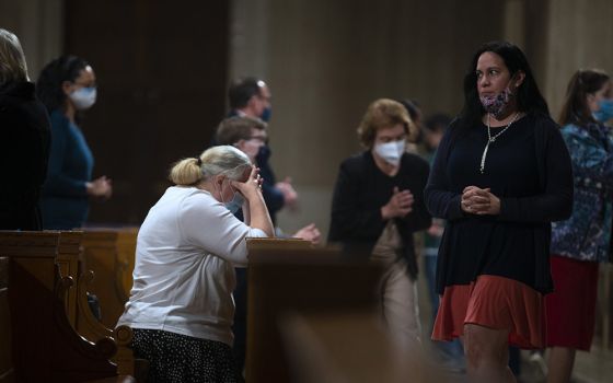 People receive Communion during Mass at the Basilica of the National Shrine of the Immaculate Conception in Washington, D.C., March 11, 2021. (CNS/Tyler Orsburn)