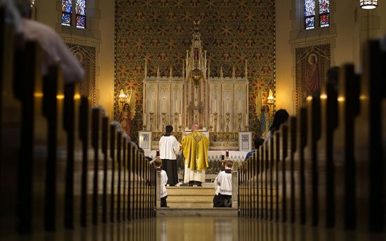 Fr. Stephen Saffron, parish administrator, prays during a traditional Latin Mass July 18 at St. Josaphat Church in the Queens borough of New York City. (CNS/Gregory A. Shemitz)
