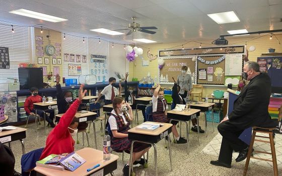 Archbishop Thomas J. Rodi of Mobile, Ala., visits students at Little Flower Catholic School in Mobile Sept. 16, 2021. (CNS photo/Jennifer Tolbert, Archdiocese of Mobile)