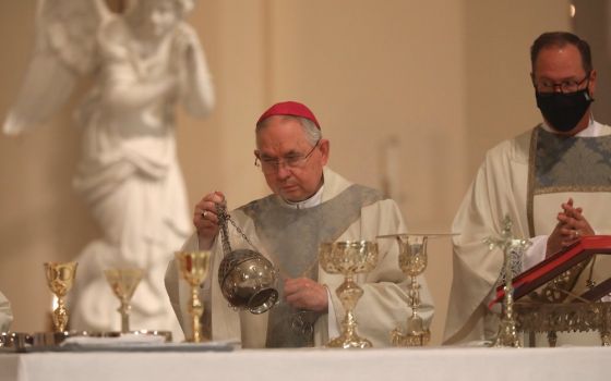 Archbishop José Gomez of Los Angeles swings a censer as he concelebrates Mass at the Basilica of the National Shrine of the Assumption of the Blessed Virgin Mary Nov. 15, 2021, in Baltimore during the bishops' fall general assembly. (CNS/Bob Roller)