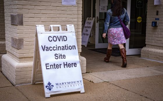 Students and faculty members at Marymount University arrive at one of the athletic buildings on the Catholic college's Arlington, Va., campus, to receive the Pfizer COVID-19 vaccine during a coronavirus vaccine clinic April 21, 2021. (CNS photo/Chaz Muth)