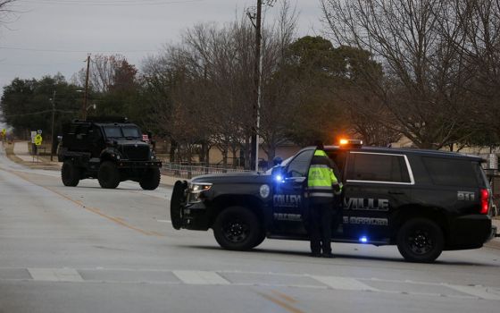 Law enforcement vehicles in Colleyville, Texas, are seen Jan. 15 near the area where a man took four people hostage at a synagogue. (CNS/Reuters/Shelby Tauber)