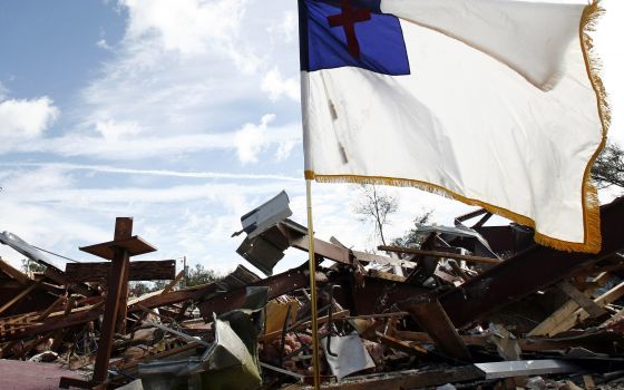 A Christian flag is seen in 2007 amid tornado rubble in Lady Lake, Fla., in this illustration photo. The flag pictured is like the one the group Camp Constitution wanted to have fly outside Boston's City Hall and city officials denied it in 2017. (CNS pho