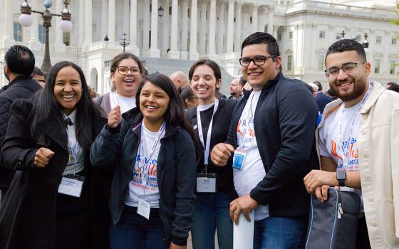 Kimberly Garcia, Guadalupe Saez, Janet Chávez España, Karla Miranda, Alejandro González and Marvin Molina from the Diocese of Arlington, Virginia, pose for a photo near the U.S. Capitol in Washington April 27 during the Raíces y Alas advocacy day.