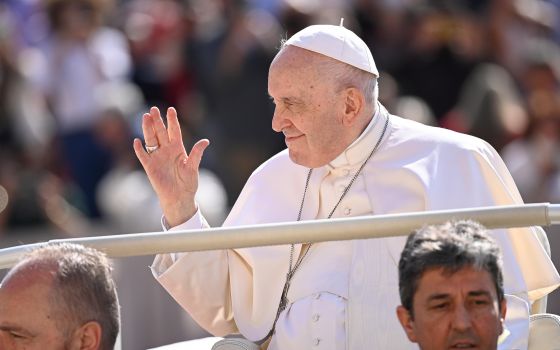 Pope Francis waves to the crowd gathered in St. Peter's Square at the Vatican May 11, 2022, for his weekly general audience. (CNS photo/Vatican Media)