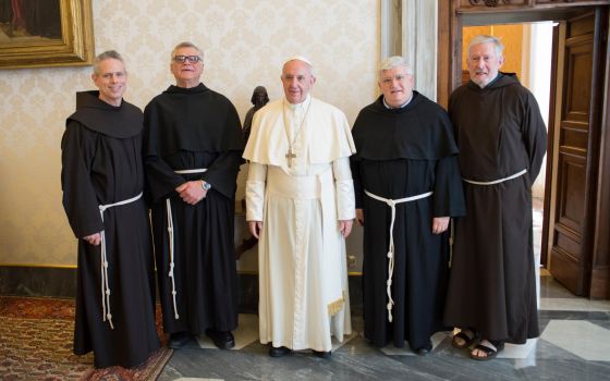  Pope Francis poses with the superiors of the four main men's branches of the Franciscan family during a meeting at the Vatican, April 10, 2017. (CNS photo/Vatican Media)