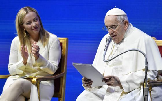 Italian Prime Minister Giorgia Meloni applauds Pope Francis during a meeting about families and Italy's declining birthrate May 12, 2023, in Rome. (CNS photo/Vatican Media)