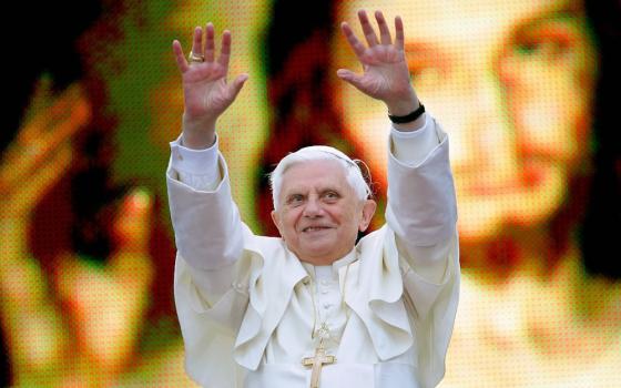 Pope Benedict XVI greets an estimated 600,000 youths while standing in front of a huge portrait of Christ in Krakow, Poland, May 27, 2006. (CNS/OSV News/Reuters/Max Rossi)