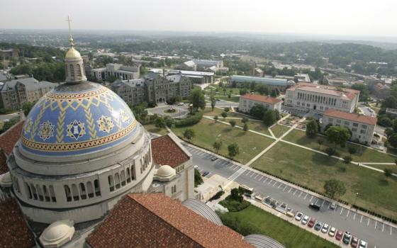 The blue and yellow dome of The Catholic University of America's dome is seen in an aerial photograph of the campus