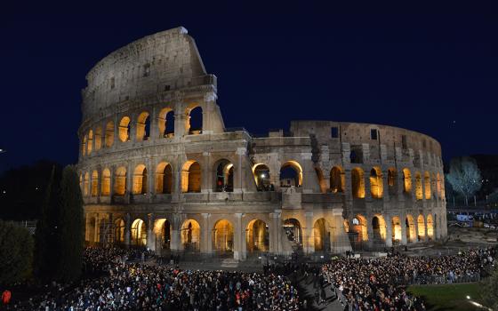 Crowds gather at Rome's Colosseum for the nighttime Way of the Cross service on Good Friday, April 7, 2023. The Vatican announced Pope Francis would not attend the event as planned because of the cold. (CNS/Chris Warde-Jones)