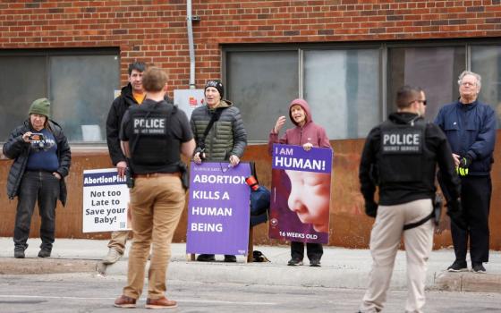 People protest abortion as U.S. Vice President Kamala Harris visits an abortion clinic in Minneapolis on March 14. 