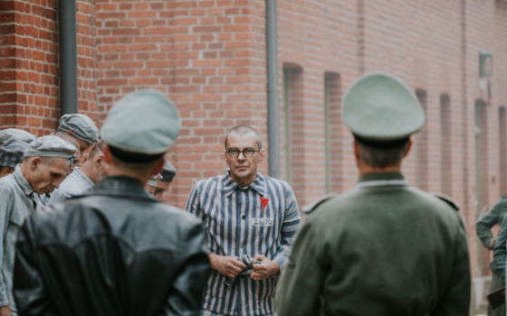 The Polish priest Maximillian Kolbe, portrayed by Marcin Kwasny, enters Auschwitz concentration camp in a scene from the forthcoming film, "Triumph of the Heart."