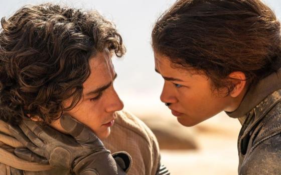 "Dune: Part Two,"' starring Timothée Chalamet as Paul and Zendaya as Chani, is "a haunting realization of the dangers of religious fundamentalism," writes Kevin Christopher Robles. (Courtesy of Legendary and Warner Bros. Entertainment Inc.)