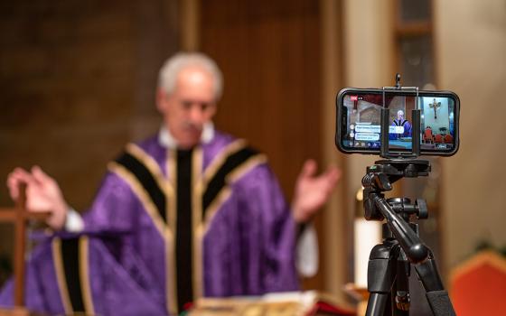 Mass is livestreamed on Facebook by Fr. Tom Kovatch at St. Charles Borromeo Catholic Church in Bloomington, Indiana, March 24, 2020, during the COVID-19 pandemic. (CNS/Katie Rutter)