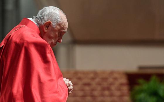Pope Francis prays during the Good Friday Liturgy of the Lord's Passion in St. Peter's Basilica at the Vatican March 29. (CNS/Vatican Media)