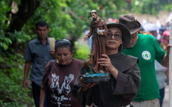 The people who participated in the Sept. 26 walk in San Francisco Angulo, El Salvador, called for the intercession of St. Francis of Assisi, patron saint of animals, ecology and the environment. (Lissette Lemus) 