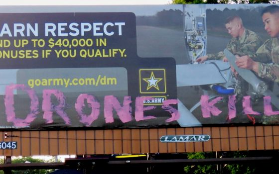 An Army billboard is seen with the words "Drones kill" in the Des Moines, Iowa, area. According to Des Moines Catholic Worker Frank Cordaro, an anonymous "Christian political artist" is targeting Army billboards in an effort to protest the use of drones. 