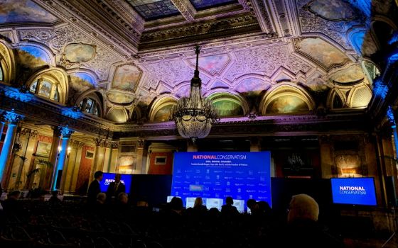 The National Conservatism event gets underway Feb. 4 in the ballroom of Rome’s Grand Hotel Plaza. (NCR photo/Joshua J. McElwee)