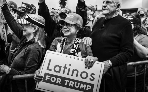 A woman holds a "Latinos for Trump" sign at a Las Vegas "Make America Great Again" rally in February (Courtesy of Bear Guerra and Quiet Pictures)