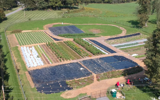 An aerial photograph of Little Portion Farm in Ellicott City, Maryland, which raises organic crops for a soup kitchen in nearby Baltimore. The photograph was part of the presentation by Matthew Jones, farm and outreach coordinator for Little Portion Farm,